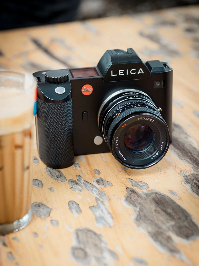 Leica 50mm f/1.4 Summilux-M ASPH lens with its hood and caps.